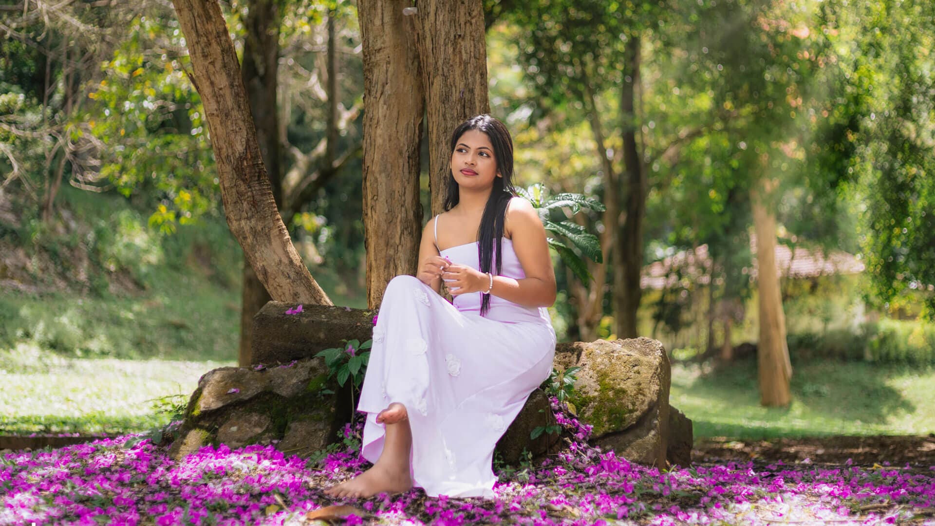 Professional model posing elegantly in a studio setting.